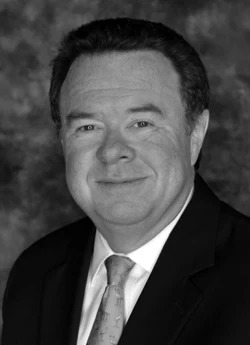 Mark Frisse in a suit and tie