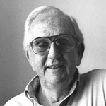 Harold J. Leavitt in glasses, smiling