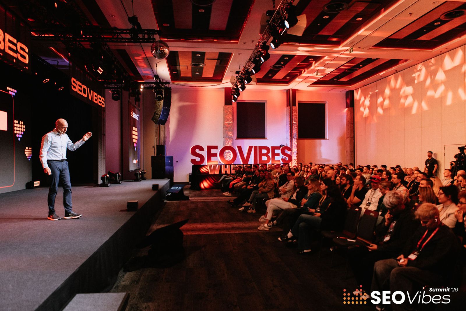 Stephen Burns delivering the keynote on the main stage at SEO Vibes Summit 2026 in Zakopane, Poland